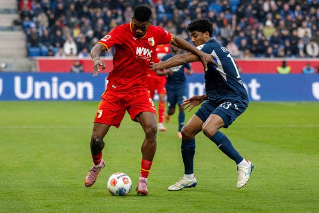 Samuel Essende FC Augsburg and Bernardo Fernandes Da Silva Junior TSG 1899 Hoffenheim xettx, Germany, Sinsheim, 29 11 2025, Football, Bundesliga TSG 1899 Hoffenheim vs FC Augsburg, Season 2025 2026, Matchday 12, PreZero Arena DFL DFB REGULATIONS PROHIBIT ANY USE OF PHOTOGRAPHS AS IMAGE SEQUENCES AND OR QUASI VIDEO