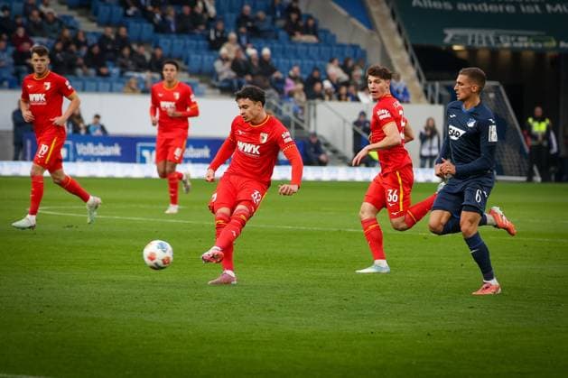 Fabian Rieder 32 FC Augsburg with a pass, TSG Hoffenheim vs FC Augsburg, Football, Bundesliga, DFL, Saison 2025 2026, Hinrunde, 12 Spieltag, 29 11 2025 DFB regulations prohibit any use of photographs as image sequences and or quasi video Sinsheim Baden Wuerttemberg Germany Copyright: xkolbert-press MartinxAgüerax