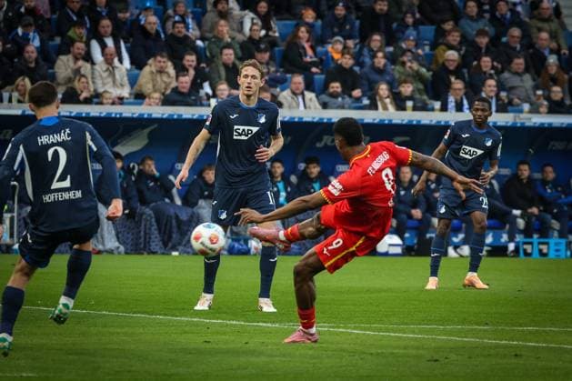 Samuel Essende 9 FC Augsburg in action, with shot on goal, TSG Hoffenheim vs FC Augsburg, Football, Bundesliga, DFL, Saison 2025 2026, Hinrunde, 12 Spieltag, 29 11 2025 DFB regulations prohibit any use of photographs as image sequences and or quasi video Sinsheim Baden Wuerttemberg Germany Copyright: xkolbert-press MartinxAgüerax