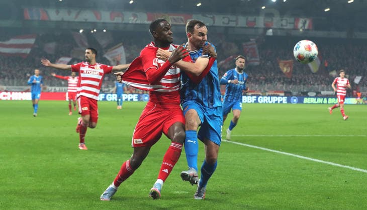 Ilyas Ansah in a duel with Benedikt Gimber Action Match scene Sport Football Soccer Bundesliga Men DFL 12 Matchday Season 2025 2026 29 11 2025 1 FC Union Berlin FCU vs 1 FC Heidenheim FCH DFL regulations prohibit any use of photographs as image sequences and or quasi video