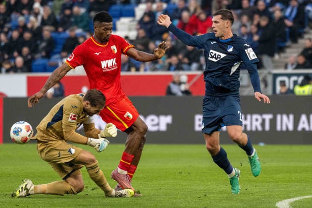 Goalkeeper Oliver Baumann TSG 1899 Hoffenheim , Samuel Essende FC Augsburg and Robin Hranac TSG 1899 Hoffenheim xettx, Germany, Sinsheim, 29 11 2025, Football, Bundesliga TSG 1899 Hoffenheim vs FC Augsburg, Season 2025 2026, Matchday 12, PreZero Arena DFL DFB REGULATIONS PROHIBIT ANY USE OF PHOTOGRAPHS AS IMAGE SEQUENCES AND OR QUASI VIDEO