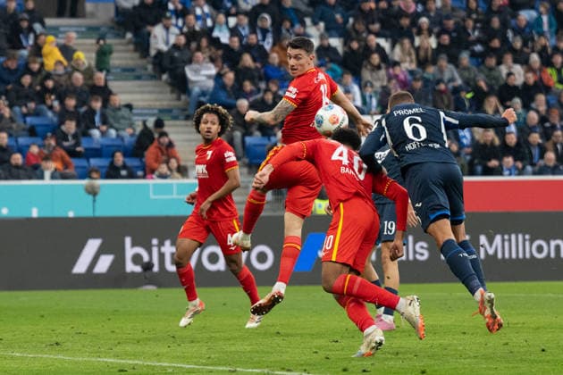 Goal for 3 0 by Grischa Proemel TSG 1899 Hoffenheim, 06 li Cedric Zesiger FC Augsburg, 16 , Noahkai Banks FC Augsburg, 40 GER, TSG 1899 Hoffenheim vs FC Augsburg, Football, Men, 1 Bundesliga, Matchday 12, Season 2025 2026, 29 11 2025, DFL DFB REGULATES PROHIBIT ANY USE OF PHOTOGRAPHS AS IMAGE SEQUENCES AND OR QUASI VIDEO, GER, TSG 1899 Hoffenheim vs FC Augsburg, Football, Men, 1 Bundesliga, Matchday 12, Season 2025 2026, 29 11 2025 Sinsheim Copyright: xEibner-Pressefoto WolfgangxFrankx EP_WFK