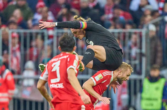 Konrad Laimer of FC Bayern München compete for the ball, tackling, duel, header, zweikampf, action, fight against Jackson Irvine of St.Pauli in the match FC BAYERN MÜNCHEN - FC ST. PAULI on November 29, 2025 at Allianz Arena München, Germany. Season 2026 2026, 1.Bundesliga, FCB, matchday 12,