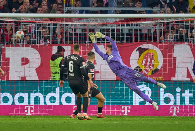 Raphael Guerreiro of FC Bayern München scores, shoots goal , Tor, Treffer, Torschuss, 1-1 against Nikola Vasilj of St.Pauli in the match FC BAYERN MÜNCHEN - FC ST. PAULI on November 29, 2025 at Allianz Arena München, Germany. Season 2026 2026, 1.Bundesliga, FCB, matchday 12,