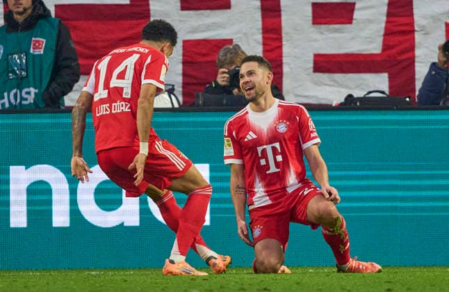 Raphael Guerreiro of FC Bayern München celebrates his her goal, happy, laugh, celebration, 1-1 with Luis Fernando Diaz of FC Bayern München in the match FC BAYERN MÜNCHEN - FC ST. PAULI on November 29, 2025 at Allianz Arena München, Germany. Season 2026 2026, 1.Bundesliga, FCB, matchday 12,