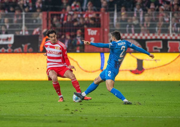 Soccer, Men, Season 2025 2026, 1 Bundesliga 12 Matchday , 1 FC Union Berlin 1 FC Heidenheim, v l Diogo Leite 1 FC Union Berlin , Marnon Busch Heidenheim , 29 11 2025, Copyright: xSebastianxRäppold MatthiasxKochx