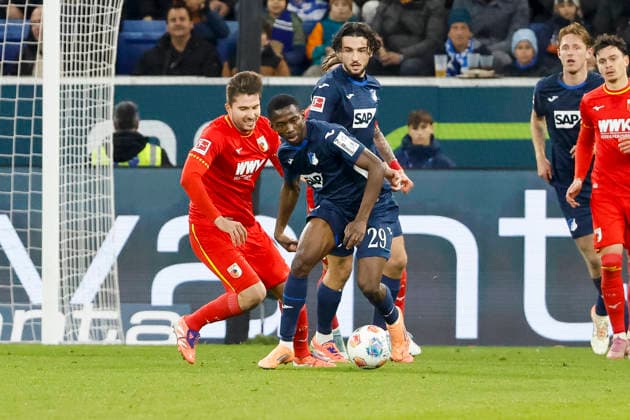 Elvis Rexhbecaj FC Augsburg, 08 and Bazoumana Toure TSG Hoffenheim, 29 fighting for the ball , Germany, Football, 1 Bundesliga, Matchday 12, 2025 2026, TSG Hoffenheim vs FC Augsburg, 29 11 2025, PreZero Arena, Sinsheim, Germany Sinsheim PreZero Arena Baden Württemberg Germany Copyright: xGrantxHubbsx