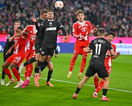 29 11 2025, Soccer Bundesliga 2025 2026, Matchday 12, FC Bayern Munich FC St Pauli, in the Allianz Arena Munich, James Sands FC St Pauli vs Lennart Karl FC Bayern Munich DFL and DFB regulations prohibit any use of photographs as image sequences and or quasi video