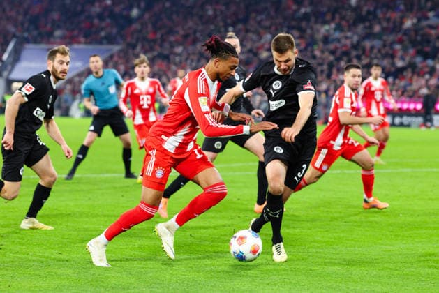 Michael Olise 17, FC Bayern Munich and Karol Mets 3, FC St Pauli at the match between FC Bayern Munich v FC St Pauli, Football, Men, Bundesliga, 2025 2026, Matchday 12 on 29 11 2025 in Munich, Allianz Arena DFL and DFB regulations prohibit any use of photographs as image sequences and or quasi video Bayern Germany