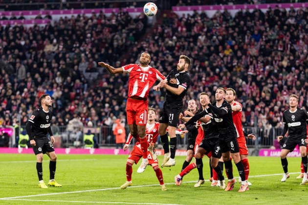 MUENCHEN, GERMANY - NOVEMBER 29: Jonathan Tah (FC Bayern Muenchen, 4) and Lars Ritzka (FC St. Pauli, 21) battle for the ball during the Bundesliga match between FC Bayern Muenchen vs. FC St. Pauli at Allianz Arena on matchday 12 of the 1. Bundesliga on November 29, 2025 in Muenchen, Germany. DFL REGULATIONS PROHIBIT ANY USE OF PHOTOGRAPHS AS IMAGE SEQUENCES AND OR QUASI-VIDEO. Bayern Germany Copyright: xBEAUTIFULxSPORTS Wunderlx