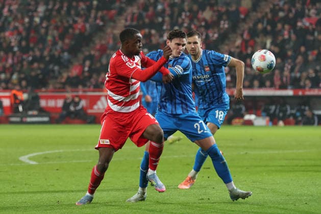 29 11 2025, xtgx, Soccer 1 Bundesliga, 1 FC Union Berlin 1 FC Heidenheim emspor, v l Ilyas Ansah Union Berlin, 10 , Thomas Keller Heidenheim, 27 duel, duel, fight, tackle DFL DFB REGULATIONS PROHIBIT ANY USE OF PHOTOGRAPHS as IMAGE SEQUENCES and or QUASI VIDEO Berlin