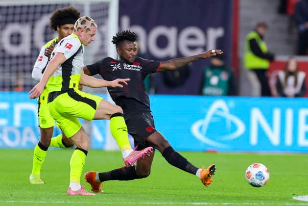 Julian Ryerson Borussia Dortmund and Edmond Tapsoba Bayer 04 Leverkusen battle for the ball, Bundesliga, Bayer 04 Leverkusen v Borussia Dortmund, BayArena, November 29, 2025 in Leverkusen, Germany Photo by Marco Steinbrenner DeFodi Images Julian Ryerson Borussia Dortmund and Edmond Tapsoba Bayer 04 Leverkusen battle for the ball, Bundesliga, Bayer 04 Leverkusen v Borussia Dortmund, BayArena, November 29, 2025 in Leverkusen, Germany Photo by Marco Steinbrenner DeFodi Images DFL regulations prohibit any use of photographs as image sequences and or quasi video