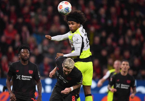 29 11 2025, xophax, Soccer 1 Bundesliga, Bayer 04 Leverkusen Bour Dortmund V l n right Edmond Tapsoba , Robert Andrich both Bayer 04 Leverkusen and Karim Adeyemi Bour Dortmund , above DFL DFB REGULATIONS PROHIBIT ANY USE OF PHOTOGRAPHS as IMAGE SEQUENCES and or QUASI VIDEO Leverkusen