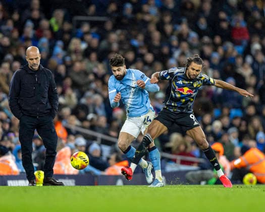 29th November 2025; Etihad Stadium, Manchester, Lancashire, England; Premier League Football, Manchester City versus Leeds United; Dominic Calvert-Lewin of Leeds United under pressure from Josko Gvardiol of Manchester City  TimxWilliams