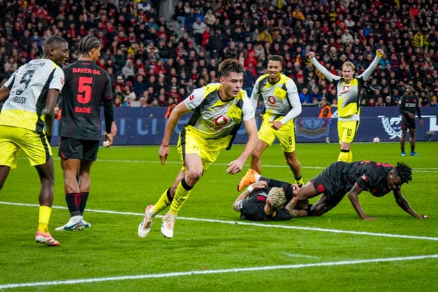 Germany Bundesliga 2025 26, Matchday 12 Bayer 04 Leverkusen vs Borussia Dortmund BayArena Leverkusen Goal and goal celebration to 0 1 by Aaron Anselmino Borussia Dortmund, 28 Joy, emotions, jubilation Copyright: xJOERANxSTEINSIEKx