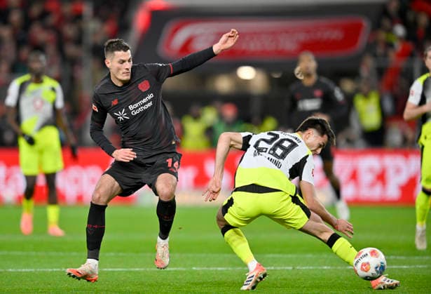 v l Patrik Schick Bayer Leverkusen , Aaron Anselmino Borussia Dortmund action, duel, Football 1 Bundesliga,12 Matchday, Bayer 04 Leverkusen Borussia Dortmund, on 29 11 2025 in Leverkusen Germany DFL regulations prohibit any use of photographs as image sequences and or quasi video Â