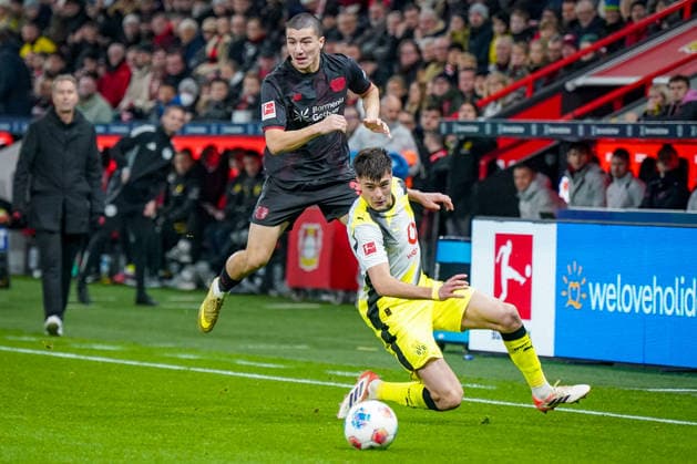 Germany Bundesliga 2025 26, 12 Matchday Bayer 04 Leverkusen vs Borussia Dortmund BayArena Leverkusen Aaron Anselmino Borussia Dortmund, 28 and Ibrahim Maza Bayer Leverkusen, 30 Copyright: xJOERANxSTEINSIEKx