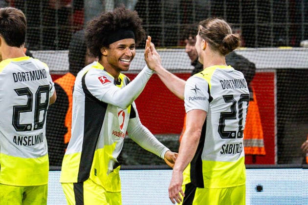 29 11 2025, Bayer 04 Leverkusen vs Borussia Dortmund, 1 Bundesliga, Matchday 12 Goal and celebration for 0 2 by Karim Adeyemi Borussia Dortmund, 27 with Fabio Silva Borussia Dortmund, 21 Nico Schlotterbeck Borussia Dortmund, 4 Marcel Sabitzer Borussia Dortmund, 20 Nico Schlotterbeck Borussia Dortmund, 4 Felix Nmecha Borussia Dortmund, 8 Important note In accordance with the regulations of the DFL German Football League and the DFB German Football Association, it is prohibited to use photographs taken in the stadium and or of the match in the form of sequential images and or video-like photo series Copyright: xBahhoxKarax