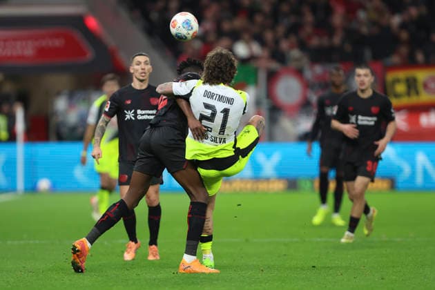 Edmond Tapsoba Bayer 04 Leverkusen and Fabio Silva Borussia Dortmund battle for the ball during the Bundesliga match between Bayer 04 Leverkusen and Borussia Dortmund, BayArena on November 29, 2025 in Leverkusen, Germany, Germany Photo by Oliver Kaelke DeFodi Images Edmond Tapsoba Bayer 04 Leverkusen and Fabio Silva Borussia Dortmund battle for the ball during the Bundesliga match between Bayer 04 Leverkusen and Borussia Dortmund at BayArena on November 29, 2025 in Leverkusen, Germany Photo by Oliver Kaelke DeFodi Images DFL regulations prohibit any use of photographs as image sequences and or quasi video Photo by Oliver Kaelke DeFodi Images