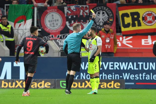 Yan Couto Borussia Dortmund gets the yellow card during the Bundesliga match between Bayer 04 Leverkusen and Borussia Dortmund, BayArena on November 29, 2025 in Leverkusen, Germany Photo by Oliver Kaelke DeFodi Images Yan Couto Borussia Dortmund gets the yellow card during the Bundesliga match between Bayer 04 Leverkusen and Borussia Dortmund at BayArena on November 29, 2025 in Leverkusen, Germany Photo by Oliver Kaelke DeFodi Images DFL regulations prohibit any use of photographs as image sequences and or quasi video Photo by Oliver Kaelke DeFodi Images