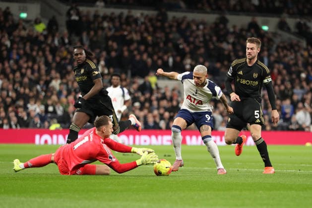 29th November 2025; Tottenham Hotspur Stadium, London, England; Premier League Football, Tottenham Hotspur versus Fulham; goalkeeper Bernd Leno of Fulham collects the ball ahead of Richarlison of Tottenham Hotspur  KatiexChan