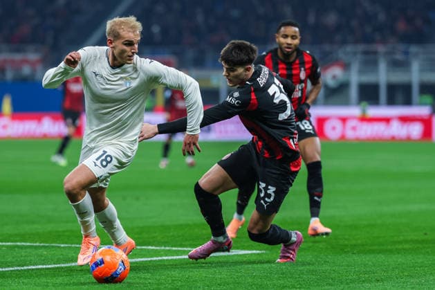 AC Milan vs SS Lazio Serie A 2025 26 29 11 2025 Christopher Alan Nkunku of AC Milan competes for the ball with Davide Bartesaghi of AC Milan during Serie A 2025 26 football match between AC Milan and SS Lazio at San Siro Stadium in Milan Copyright: xBEAUTIFULxSPORTS Carabellix