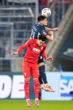 from left Albian Hajdari Hoffenheim, 21 , Fabian Rieder FCA, 32 , header, header duel, match scene, duel in the air, action, action, 29 11 2025, Sinsheim Germany , football, Bundesliga, TSG 1899 Hoffenheim FC Augsburg, DFB DFL REGULATIONS PROHIBIT ANY USE OF PHOTOGRAPHS AS IMAGE SEQUENCES AND OR QUASI VIDEO xozx