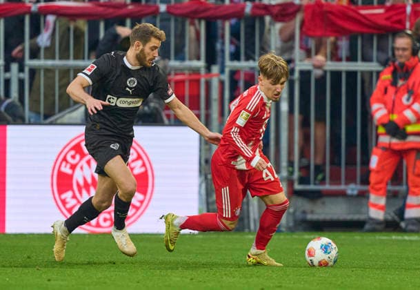 Lennart Karl of FC Bayern München compete for the ball, tackling, duel, header, zweikampf, action, fight against Lars Ritzka of St.Pauli in the match FC BAYERN MÜNCHEN - FC ST. PAULI 3-1 on November 29, 2025 at Allianz Arena München, Germany. Season 2026 2026, 1.Bundesliga, FCB, matchday 12,
