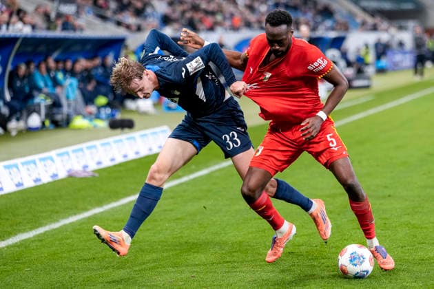 v li Max Moerstedt Hoffenheim, 33 , Chrislain Matsima FCA, 5 , duel, duel, tackle, tackling, dynamics, action, action, 29 11 2025, Sinsheim Germany , Football, Bundesliga, TSG 1899 Hoffenheim FC Augsburg, DFB DFL REGULATIONS PROHIBIT ANY USE OF PHOTOGRAPHS AS IMAGE SEQUENCES AND OR QUASI VIDEO xozx