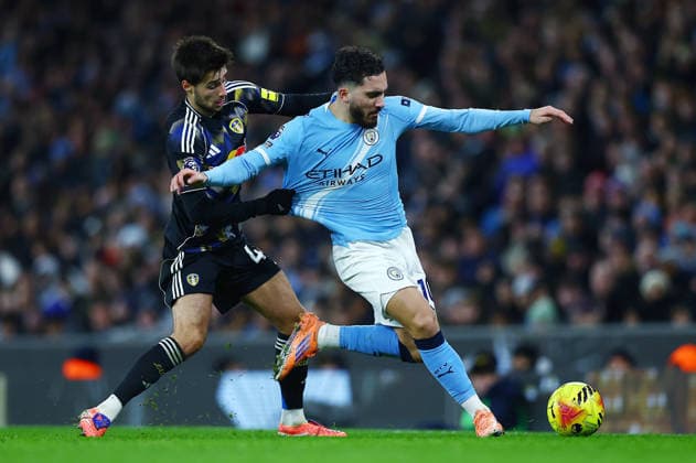 Rayan Cherki of Manchester City and Ilia Gruev of Leeds United Manchester City v Leeds United, Premier League, Football, Etihad Stadium, Manchester, UK - 29 Nov 2025Manchester Etihad Stadium United Kingdom EDITORIAL USE ONLY No use with unauthorised audio, video, data, fixture lists, club league logos or live services. Online in-match use limited to 120 images, no video emulation. No use in betting, games or single club league player publications. Copyright: xMattxWest Shutterstockx 15941574be