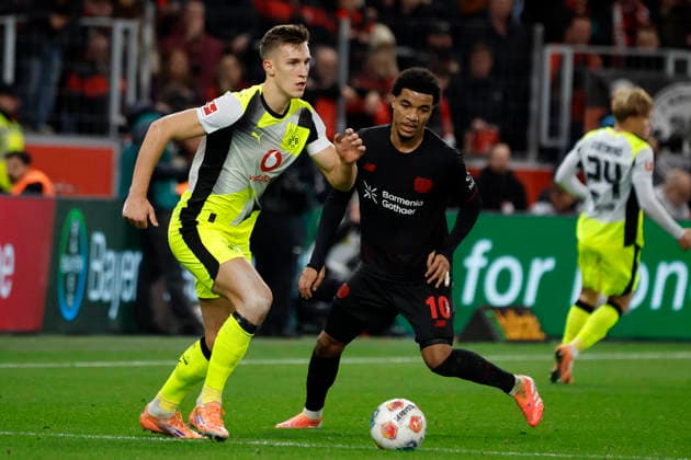 Leverkusen, Germany, 1 Soccer Bundesliga 12 Matchday Season 2025 26 Bayer 04 Leverkusen Borussia Dortmund 1 2 on 29 11 2025 at the Bay Arena in Leverkusen Nils SCHLOTTERBECK BVB left and Malik Leon TILLMAN LEV right