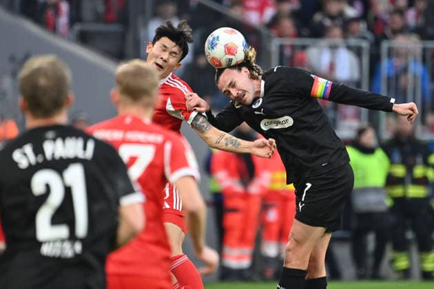 Jackson IRVINE St Pauli , Action,duel against Minjae KIM FC Bayern Muenchen Football 1 Bundesliga Season 2025 2026, 12 Matchday, Matchday12 FC Bayern Muenchen FC St Pauli 3 1 on 29 11 2025 , A L L I A N Z A R E N A