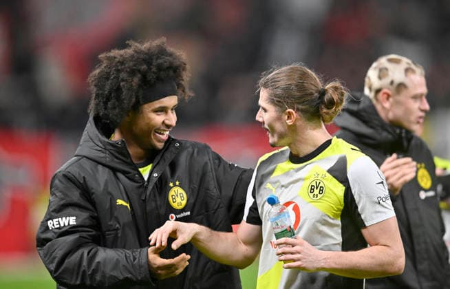 Final celebration Team DO, v l Karim Adeyemi Borussia Dortmund , Marcel Sabitzer Borussia Dortmund Football 1 Bundesliga,12 Matchday, Bayer 04 Leverkusen Borussia Dortmund 1 2, on 29 11 2025 in Leverkusen Germany DFL regulations prohibit any use of photographs as image sequences and or quasi video Â