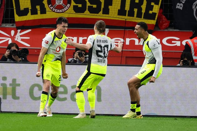 Leverkusen, BayArena, 29 11 25, GER, Men, 1 Bundesliga, Season 2025 2026, Bayer 04 Leverkusen Borussia Dortmund, Aaron Anselmino Borussia Dortmund celebrates after his goal for 1 0 with Marcel Sabitzer Borussia Dortmund and Felix Nmecha Borussia Dortmund DFB DFL REGULATIONS PROHIBIT ANY USE OF PHOTOGRAPHS AS IMAGE SEQUENCES AND OR QUASI VIDEO Copyright: JoachimxBywaletz xJB-Sportfoto