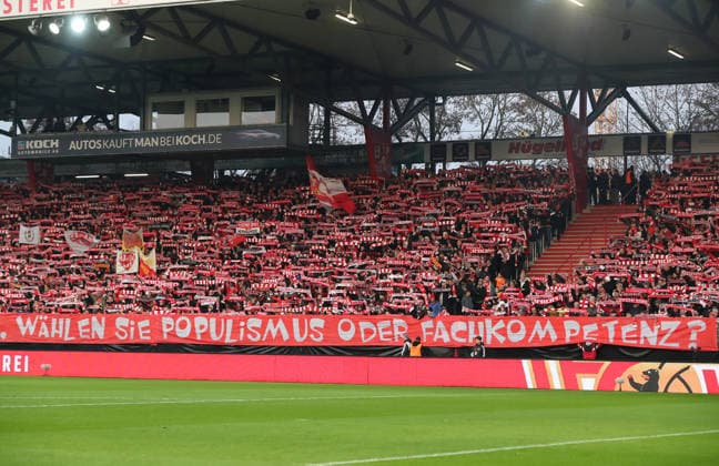 Poster, banner of the Unionfans Mrs. Spranger, choose populism or expertise , scarves Gegengerade, anthem Sport Football Soccer Bundesliga Men DFL 12 Matchday Season 2025 2026 29 11 2025 1 FC Union Berlin FCU vs 1 FC Heidenheim FCH DFL regulations prohibit any use of photographs as image sequences and or quasi video