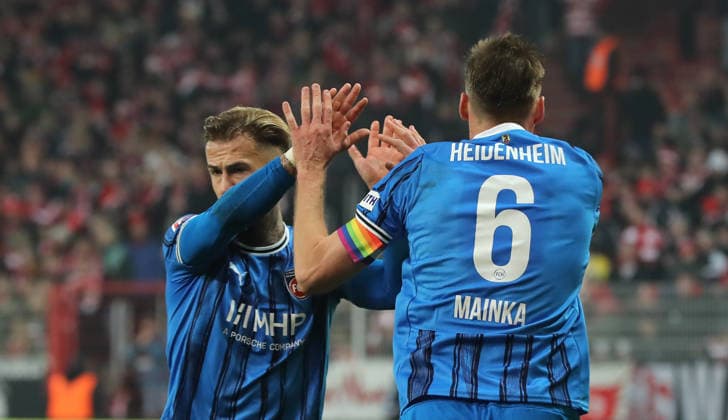 Niklas Dorsch high-fives with Patrick Mainka Action upper body Sport Football Soccer Bundesliga Men DFL 12 Matchday Season 2025 2026 29 11 2025 1 FC Union Berlin FCU vs 1 FC Heidenheim FCH DFL regulations prohibit any use of photographs as image sequences and or quasi video