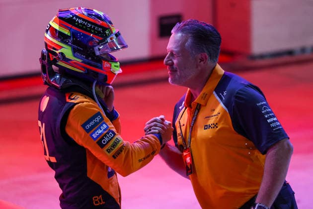 (251130) -- DOHA, Nov. 30, 2025 -- McLaren s Australian Driver Oscar Piastri reacts with Team s CEO Zak Brown (R) after the Sprint race of the Formula One Qatar Grand Prix at the Lusail International Circuit in Doha, Qatar, on Nov. 29, 2025. (Photo by Xinhua) (SP)QATAR-DOHA-F1-GRAND PRIX-SPRINT LixChao 