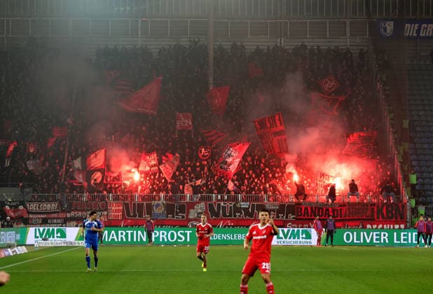 29 11 2025 Soccer Season 2025 2026 2 Soccer Bundesliga 14 Matchday 1 FC Magdeburg FCM 1 FC Nürnberg FCN Club Sportfoto Zink DaMa xdaxmax DFL regulations prohibit any use of photographs as image sequences and or quasi video only for editorial use Symbolbild Symbolfoto Feature Impression Clubfan Clubfans FCN Fans Fans with Pyro Pyro Pyro Bengalfackel Bengalfackeln Rauch im Gästeblock