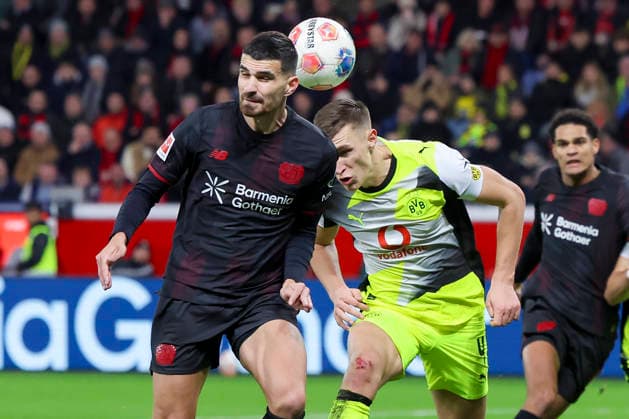 Martin Terrier Bayer 04 Leverkusen and Nico Schlotterbeck Borussia Dortmund battle for the ball, Bundesliga, Bayer 04 Leverkusen v Borussia Dortmund, BayArena, November 29, 2025 in Leverkusen, Germany Photo by Marco Steinbrenner DeFodi Images Martin Terrier Bayer 04 Leverkusen and Nico Schlotterbeck Borussia Dortmund battle for the ball, Bundesliga, Bayer 04 Leverkusen v Borussia Dortmund, BayArena, November 29, 2025 in Leverkusen, Germany Photo by Marco Steinbrenner DeFodi Images DFL regulations prohibit any use of photographs as image sequences and or quasi video