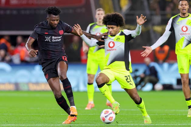 Edmond Tapsoba Bayer 04 Leverkusen and Karim Adeyemi Borussia Dortmund battle for the ball, Bundesliga, Bayer 04 Leverkusen v Borussia Dortmund, BayArena, November 29, 2025 in Leverkusen, Germany Photo by Marco Steinbrenner DeFodi Images Edmond Tapsoba Bayer 04 Leverkusen and Karim Adeyemi Borussia Dortmund battle for the ball, Bundesliga, Bayer 04 Leverkusen v Borussia Dortmund, BayArena, November 29, 2025 in Leverkusen, Germany Photo by Marco Steinbrenner DeFodi Images DFL regulations prohibit any use of photographs as image sequences and or quasi video