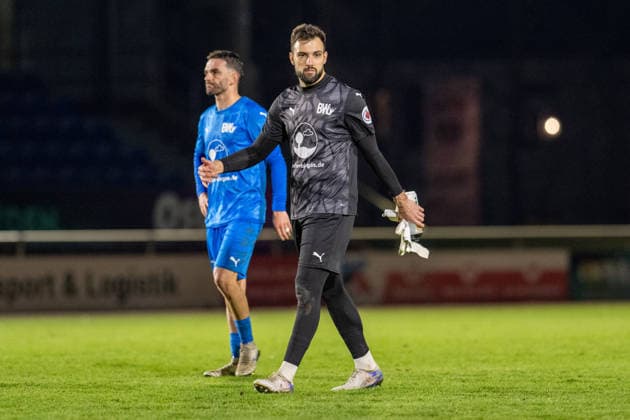 Soccer, Regionalliga Nord, BW Lohne Bremer SV, 21 Matchday, Season 2025 2026, 29 11 2025 Marko Dedovic Goalkeeper Blau Weiss Lohne 1 with Rilind Neziri Blau Weiss Lohne 23 , Lohne Heinz Dettmer Stadion Niedersachsen Germany