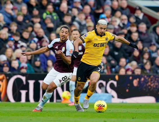Birmingham, England, 30th November 2025. Youri Tielemans of Aston Villa (l) tussles with Andre of Wolverhampton Wanderers (r) during the Aston Villa vs Wolverhampton Wanderers Premier League match at Villa Park, Birmingham. Picture credit should read: Andrew Yates Sportimage EDITORIAL USE ONLY. No use with unauthorised audio, video, data, fixture lists, club league logos or live services. Online in-match use limited to 120 images, no video emulation. No use in betting, games or single club league player publications. SPI_016_AY_Villa_Wolves SPI-4336-0016
