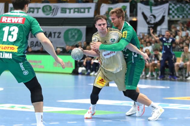 Handball DAIKIN HBL, SC DHfK Leipzig TSV Hannover Burgdorf 30 11 2025 Leif Tissier 7, Hannover Burgdorf is stopped by Franz Semper 32, SC DHfK Leipzig Handball, DAIKIN HBL, 1 Bundesliga, Season 2025 2026, Matchday 14 SC DHfK Leipzig vs TSV Hannover Burgdorf on 30 11 2025 at Quarterback Immobilien Arena Leipzig Copyright: xBEAUTIFULxSPORTS JanxKaeferx
