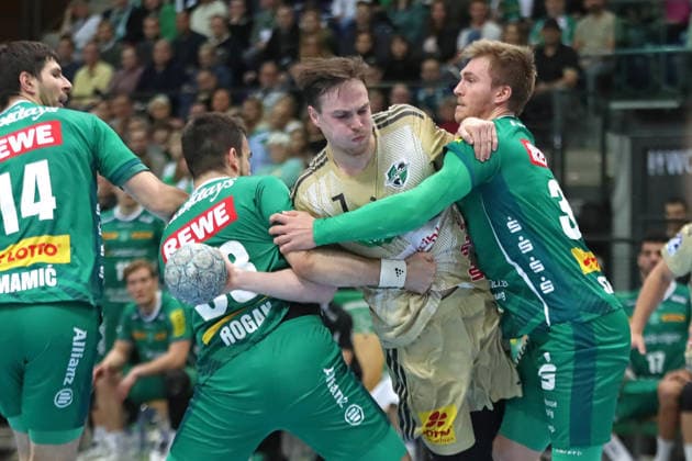Handball DAIKIN HBL, SC DHfK Leipzig TSV Hannover Burgdorf 30 11 2025 Leif Tissier 7, Hannover Burgdorf is stopped by Franz Semper 32, SC DHfK Leipzig Handball, DAIKIN HBL, 1 Bundesliga, Season 2025 2026, Matchday 14 SC DHfK Leipzig vs TSV Hannover Burgdorf on 30 11 2025 at Quarterback Immobilien Arena Leipzig Copyright: xBEAUTIFULxSPORTS JanxKaeferx