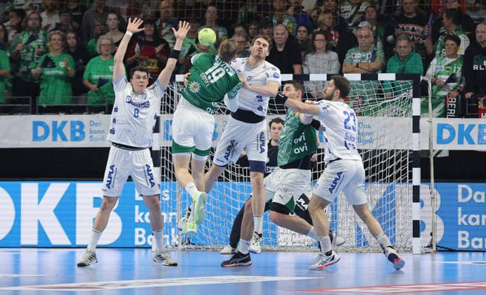 Mathias Gidsel scores a goal against Tim Suton duel Game scene Action Sport Handball HBL Bundesliga Men 14 Matchday Season 2025 2026 30 11 2025 Füchse Berlin vs TBV Lemgo Lippe