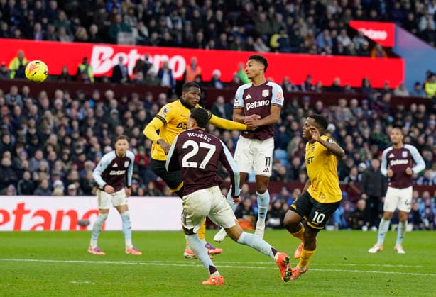 Birmingham, England, 30th November 2025. Ollie Watkins of Aston Villa directs a header towards goal during the Aston Villa vs Wolverhampton Wanderers Premier League match at Villa Park, Birmingham. Picture credit should read: Andrew Yates Sportimage EDITORIAL USE ONLY. No use with unauthorised audio, video, data, fixture lists, club league logos or live services. Online in-match use limited to 120 images, no video emulation. No use in betting, games or single club league player publications. SPI_036_AY_Villa_Wolves SPI-4336-0036