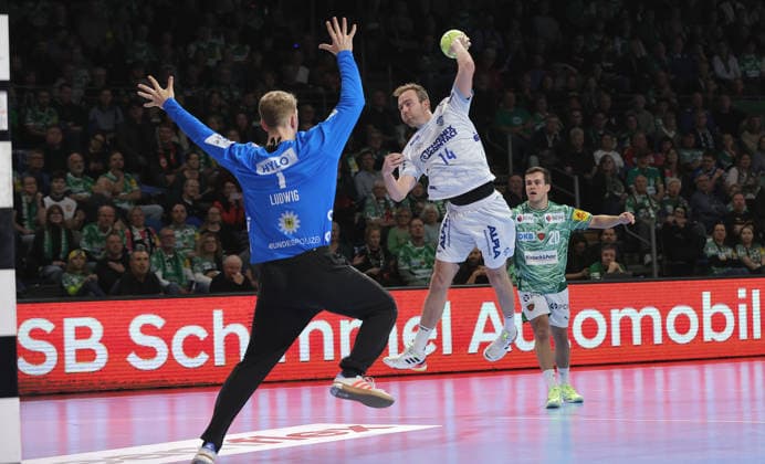 Bobby Schagen scores a goal against goalkeeper Lasse Ludwig duel Match scene Action Sport Handball HBL Bundesliga Men 14 Matchday Season 2025 2026 30 11 2025 Füchse Berlin vs TBV Lemgo Lippe