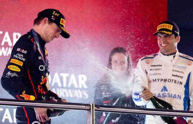 DOHA - Max Verstappen (Red Bull Racing) on the podium with Carlos Sainz (Williams) and Hannah Schmitz (Red Bull Racing s chief strategy engineer) after winning the Qatar Grand Prix at the Lusail International Circuit. ANP SANDER KONING xVIxANPxSportx xxANPxIVx 543498660 originalFilename: 543498660.jpg