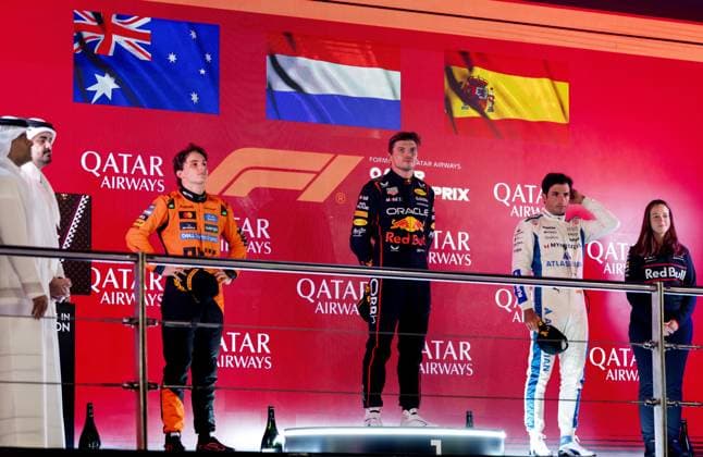 DOHA - (from left to right) Oscar Piastri (McLaren), Max Verstappen (Red Bull Racing), Carlos Sainz (Williams), and Hannah Schmitz (Red Bull Racing s chief strategy engineer) on the podium after Verstappen won the Qatar Grand Prix at the Lusail International Circuit. ANP SANDER KONING xVIxANPxSportx xxANPxIVx 543501677 originalFilename: 543501677.jpg