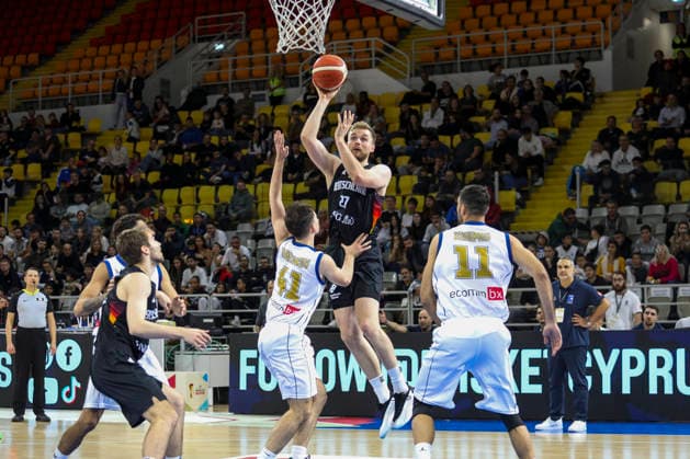 FIBA World Cup Qualifiers : Cyprus vs Germany TILL PAPE of Germany scores in front of GEORGIOS TRETIAKOV of Cyprus abd MICHALIS KOUMIS of Cyprus. Cyprus plays vs Germany for the Group E of the FIBA Basketball World Cup European Qualifiers, at Spyros Kyprianou Arena, Limassol, Cyprus, on Dec. 1, 2025. Limassol Cyprus Copyright: xKOSTASxPIKOULASx